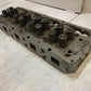 41.033 Engine Cylinder Head 327544 | 25” Long | 9” Wide | 3-3/4” Thick