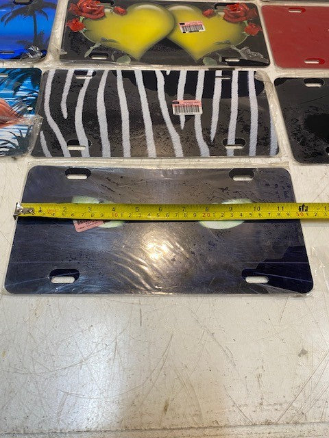 10 Qty of Various Adv. Graphics 4-Hole License Plates 11-3/4" x 5-3/4" (10 Qty)