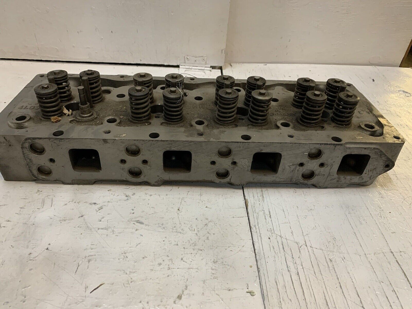 41.033 Engine Cylinder Head 327544 | 25” Long | 9” Wide | 3-3/4” Thick