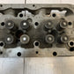 41.033 Engine Cylinder Head 327544 | 25” Long | 9” Wide | 3-3/4” Thick