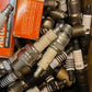 Approx 700 (90 lbs) of Miscellaneous Automotive Replacement Spark Plugs