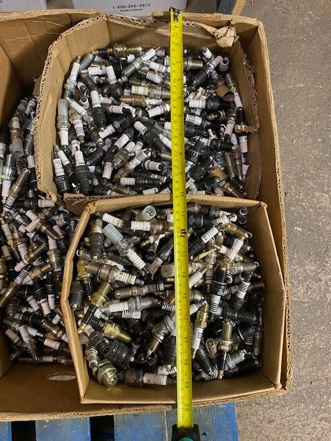 135lb Box of a Variety of Autolite, Champion, Bosch, Mighty, Denso Spark Plugs